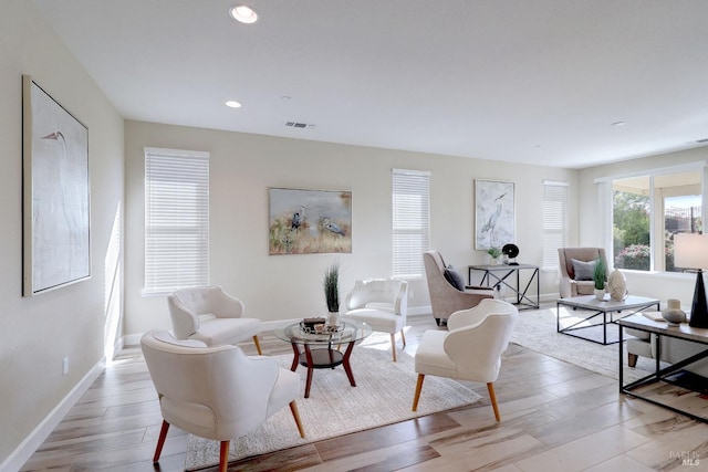 living room with light hardwood / wood-style flooring