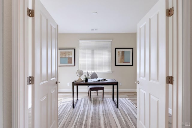 home office featuring hardwood / wood-style floors