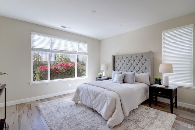 bedroom with light wood-type flooring