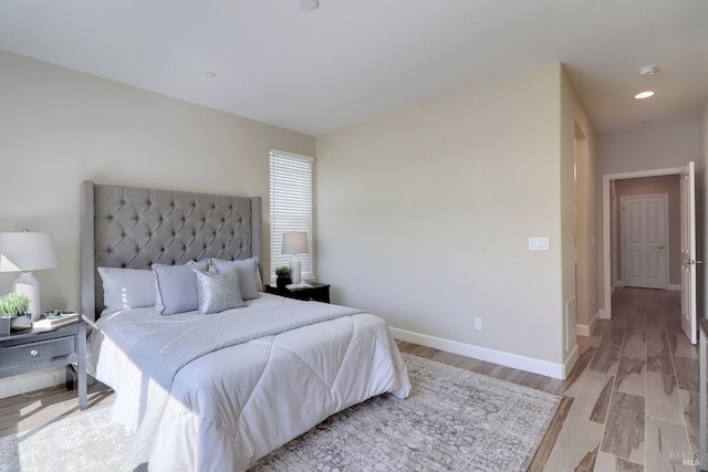 bedroom with light hardwood / wood-style flooring