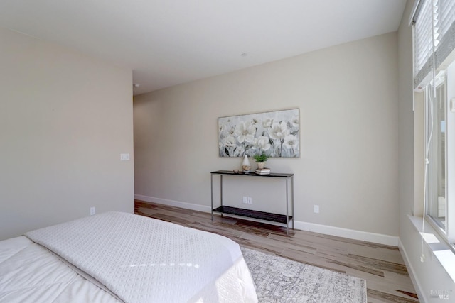 bedroom with wood-type flooring