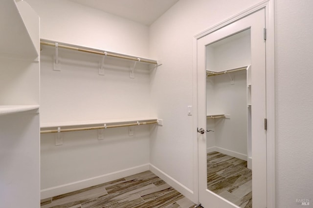 spacious closet with light wood-type flooring