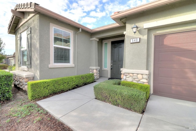 property entrance featuring a garage