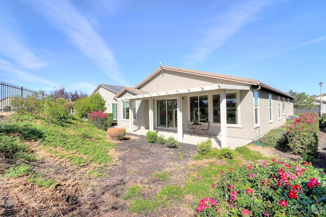 back of house featuring a patio area