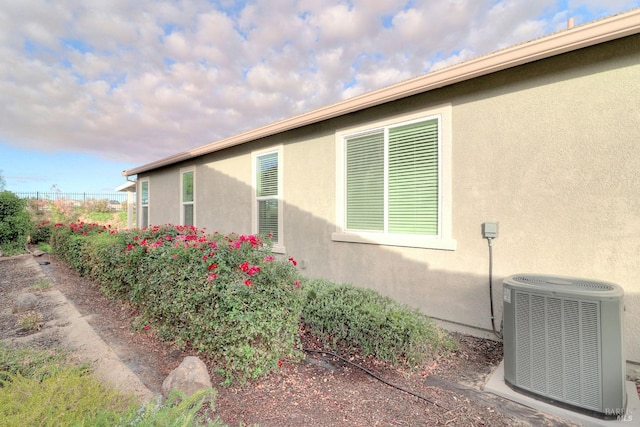 view of side of property featuring cooling unit