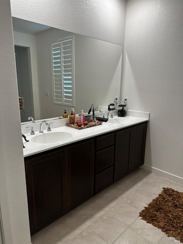 bathroom featuring vanity and tile patterned flooring