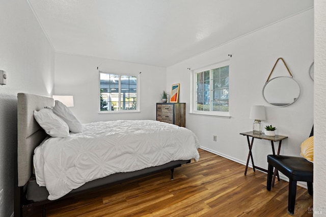 bedroom featuring dark hardwood / wood-style flooring