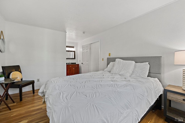 bedroom with dark wood-type flooring