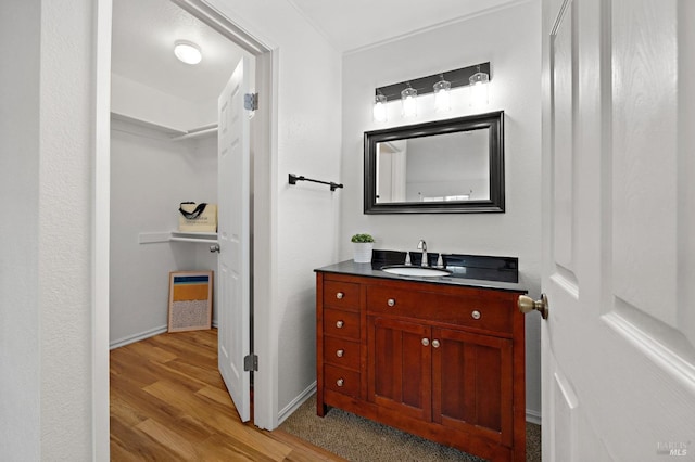 bathroom featuring hardwood / wood-style floors and vanity