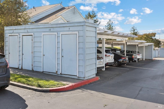 view of outdoor structure with a carport