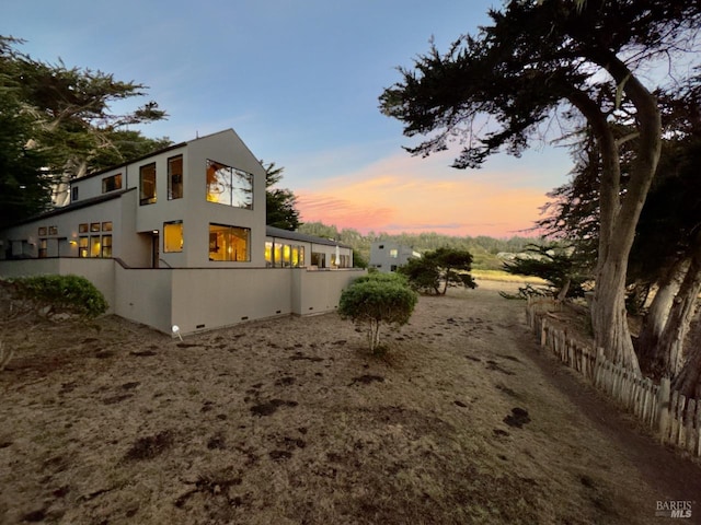 view of property exterior at dusk