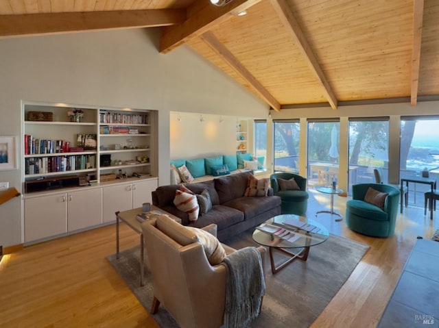 living room featuring light hardwood / wood-style floors, beam ceiling, wooden ceiling, and a wealth of natural light