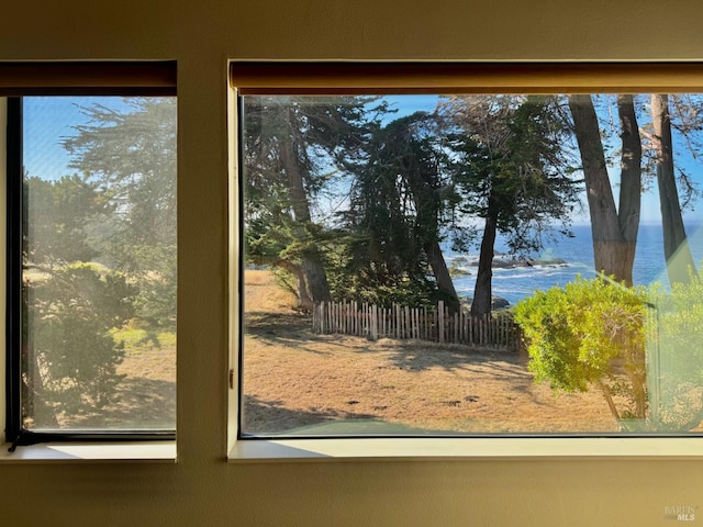 doorway to outside with a water view