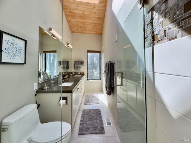 bathroom with tile patterned floors, toilet, wooden ceiling, vaulted ceiling, and vanity