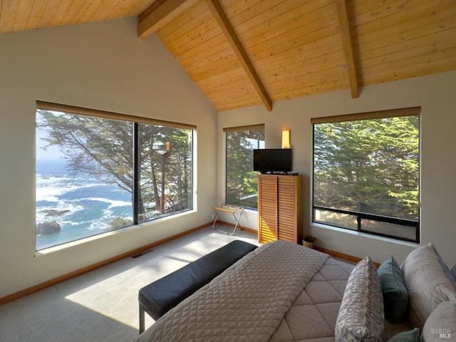 carpeted bedroom featuring vaulted ceiling with beams, multiple windows, and wood ceiling