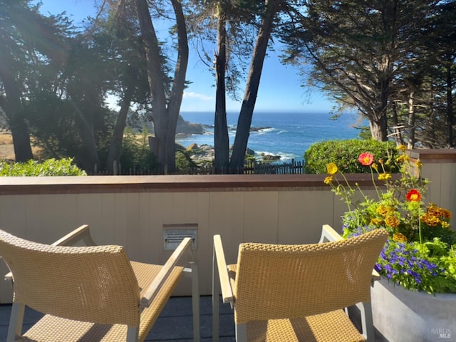 balcony featuring a water view