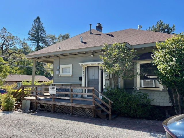 exterior space with a deck and cooling unit