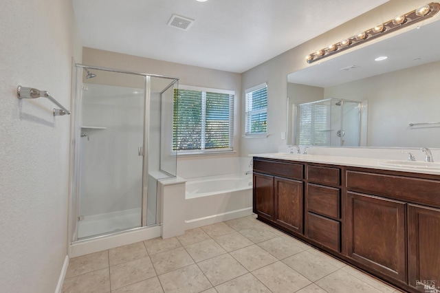 bathroom featuring vanity, plus walk in shower, and tile patterned floors