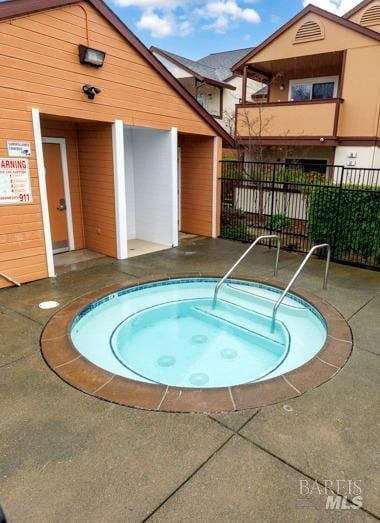 view of pool with a community hot tub