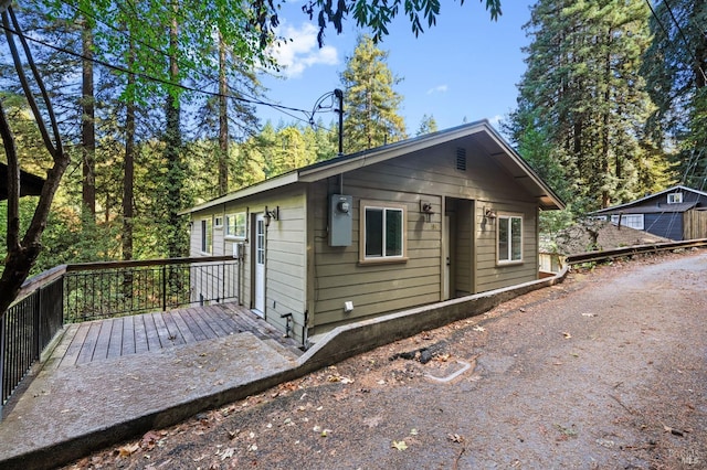 view of property exterior featuring a deck