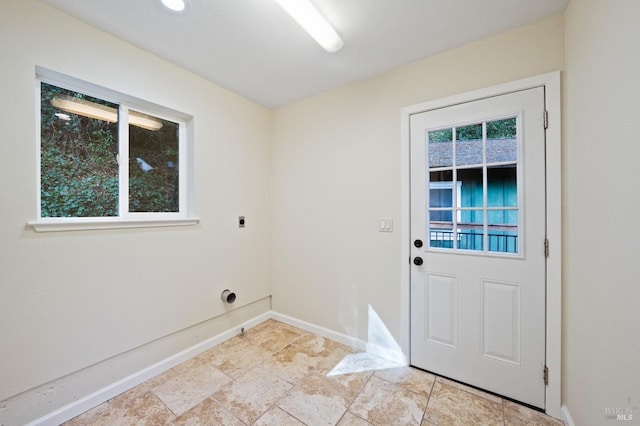 washroom with hookup for an electric dryer