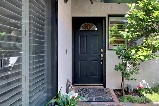 doorway to property featuring wine cooler