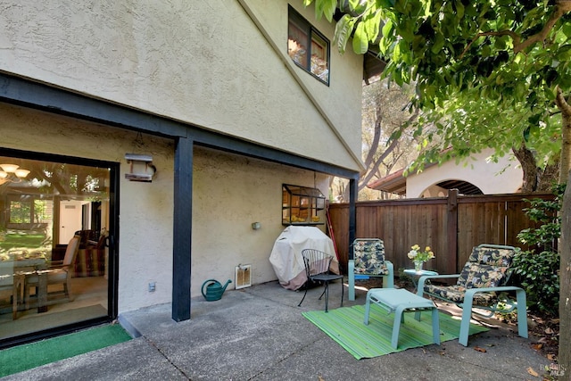 view of patio featuring a grill