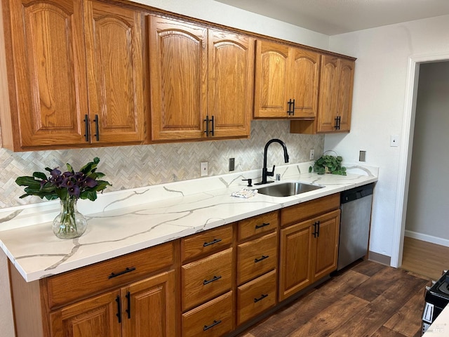 kitchen featuring sink, dishwasher, backsplash, and dark hardwood / wood-style flooring