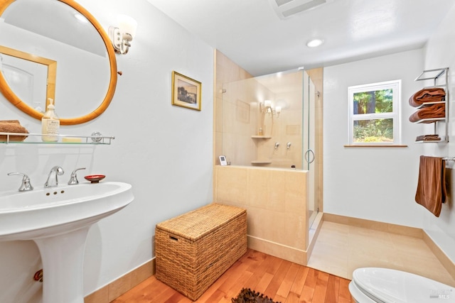 31026 Albion Ridge L Rd, Albion, CA 95410 - bathroom featuring sink, a shower with shower door, wood-type flooring, and toilet