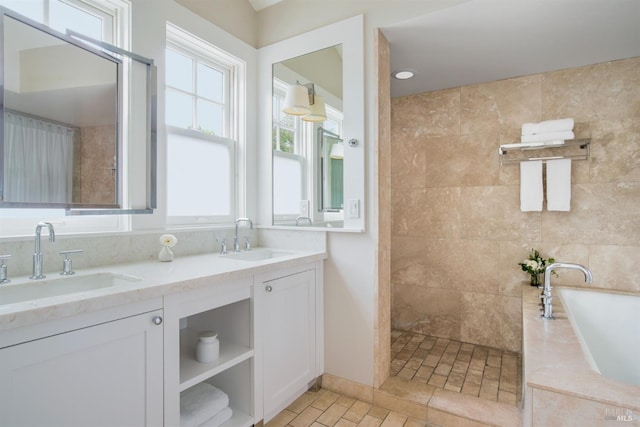 bathroom with vanity and plus walk in shower