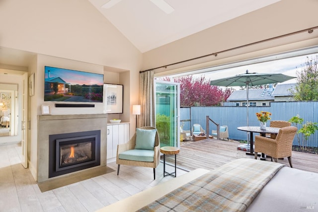 interior space featuring high vaulted ceiling, hardwood / wood-style flooring, and ceiling fan