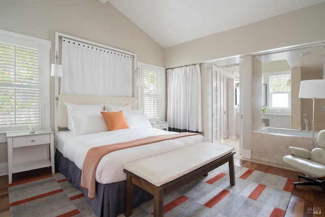 bedroom featuring wood-type flooring and vaulted ceiling