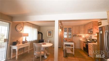 dining room featuring dark hardwood / wood-style floors and a wealth of natural light