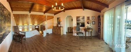 unfurnished room featuring wood ceiling, a notable chandelier, vaulted ceiling with beams, and hardwood / wood-style floors