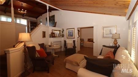 living room featuring wood ceiling, wood-type flooring, and lofted ceiling