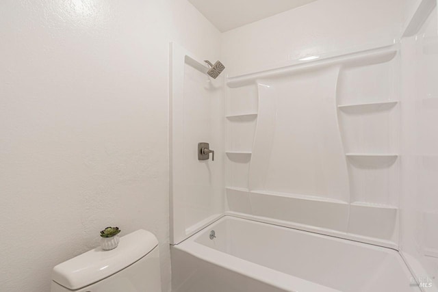 bathroom with toilet and shower / tub combination