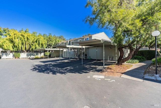 view of parking / parking lot with a carport