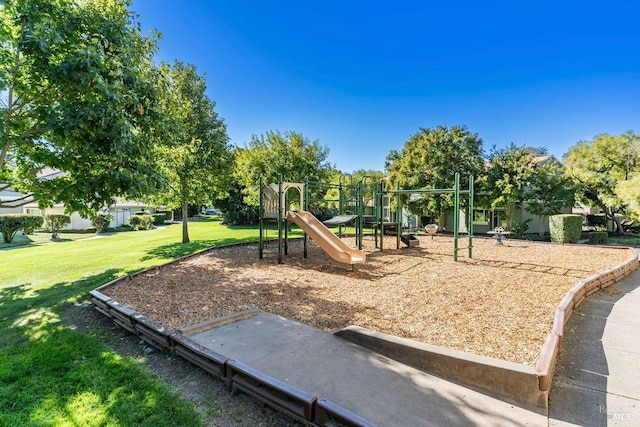 view of jungle gym with a lawn