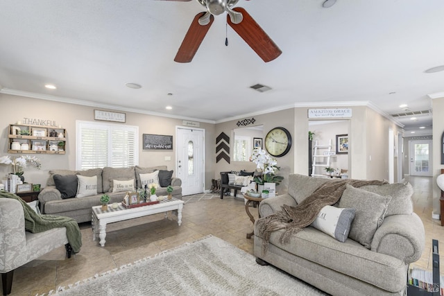 living area with a ceiling fan, recessed lighting, ornamental molding, and visible vents