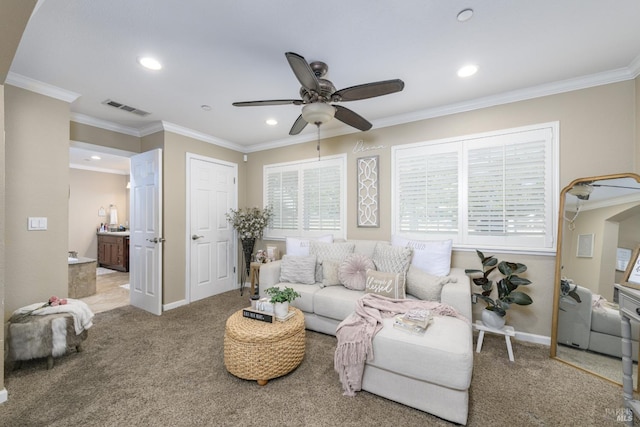 carpeted living room with baseboards, ceiling fan, visible vents, and crown molding