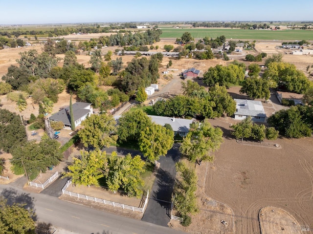 birds eye view of property with a rural view
