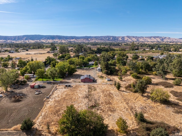 birds eye view of property featuring a mountain view