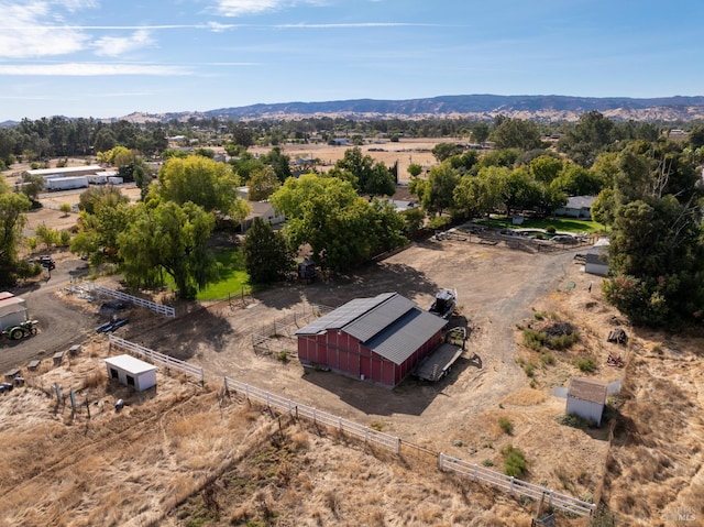 drone / aerial view with a mountain view and a rural view