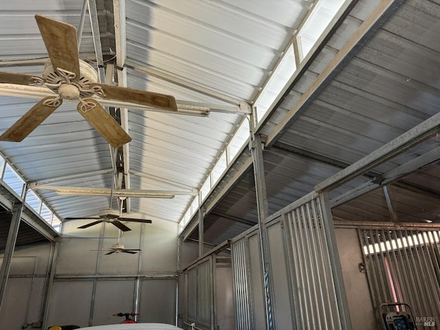 interior details with a ceiling fan and metal wall