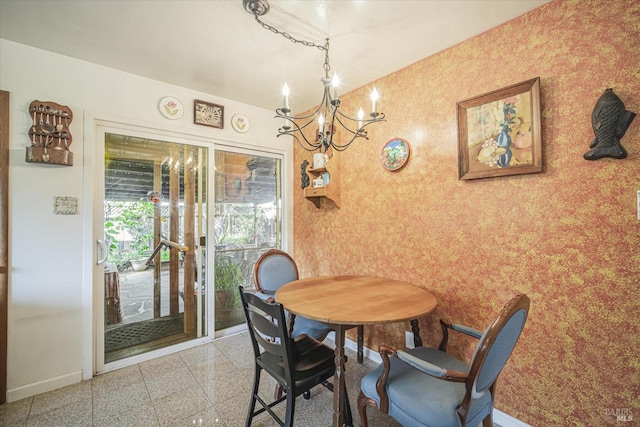 dining area with an inviting chandelier