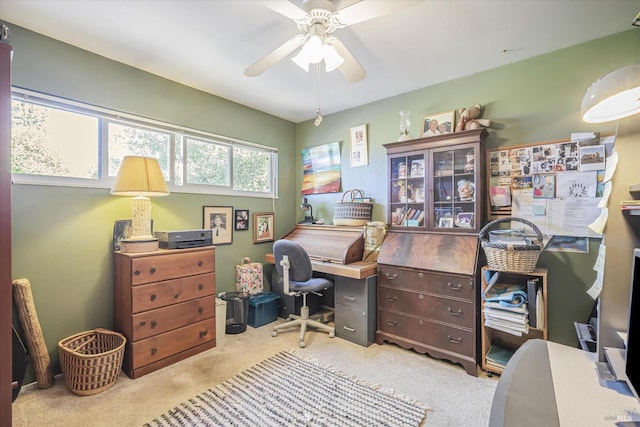 carpeted office with ceiling fan