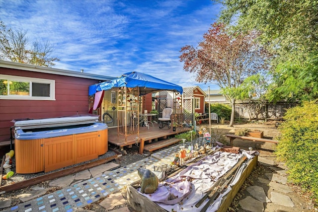 view of yard featuring a gazebo, a hot tub, and a deck