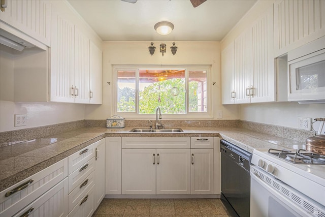 kitchen featuring sink, white cabinets, and white appliances