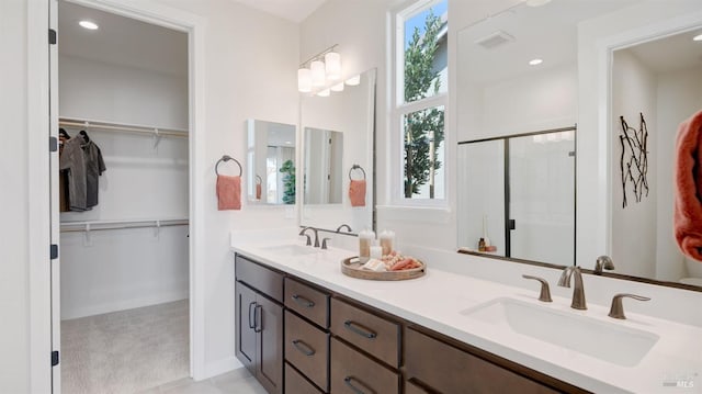 bathroom with vanity and an enclosed shower