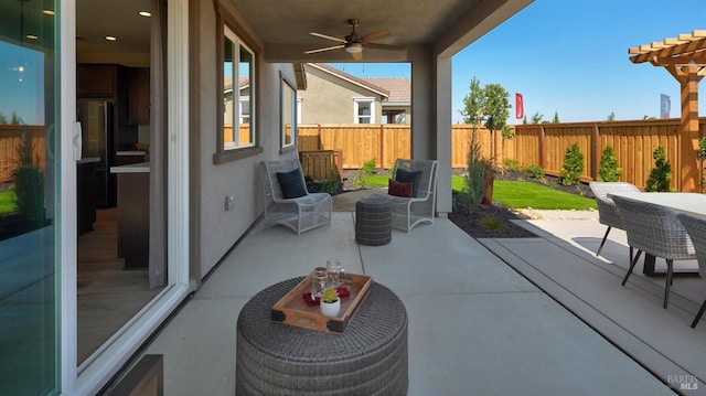 view of patio with ceiling fan